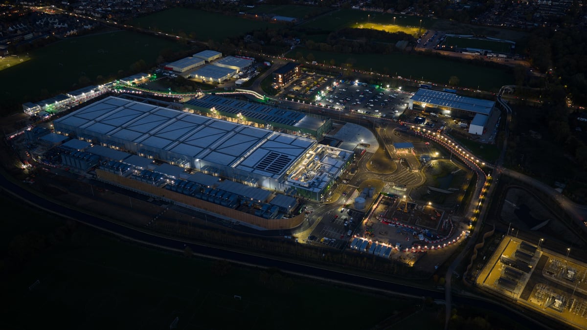 Data center under construction at night showing expansion of IT technology and cloud services